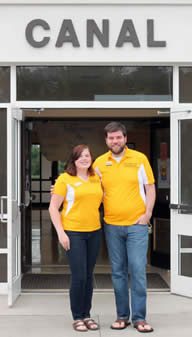 two resident directors standing outside a residence hall