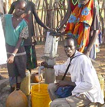 Villagers with Water for Sudan sign