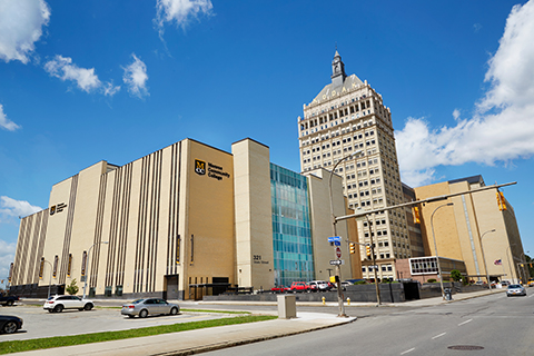 Exterior view of the Downtown campus building, with the Kodak building in the background