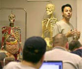 photo of teacher and skeletons