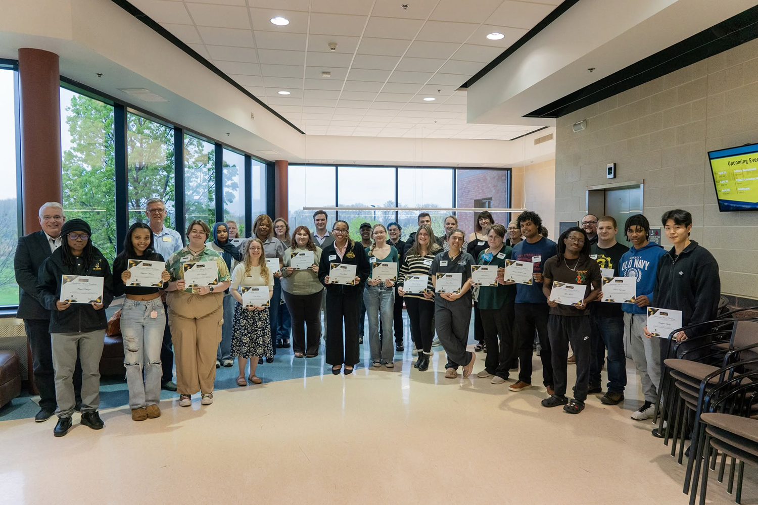 Group of students shown with awards