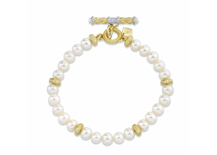 pearl bracelet with gold detailing and gold toggle clasp