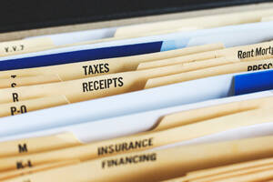 File folders containing finance and investment information