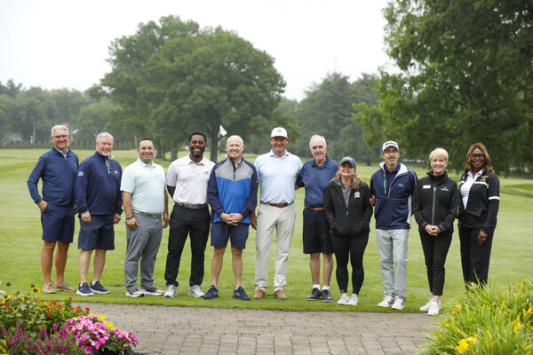 Eleven members of the MCC Foundation 2026 Scholarship Open Committee poses up along the fairway at the Country Club of Rochester.