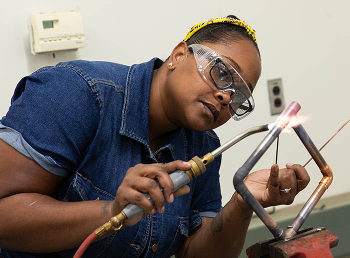 a student working on a welding project