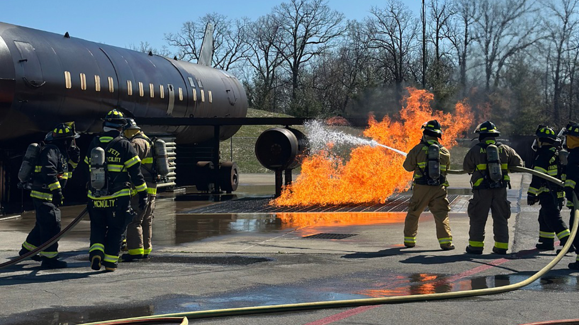 firefighters putting out a fire from a plane