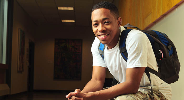 a student smiling at the camera