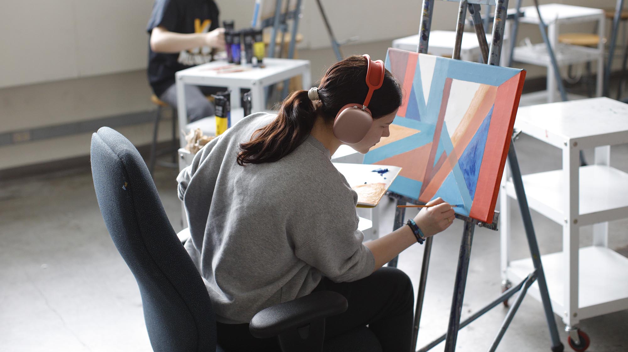 a student working on a painting