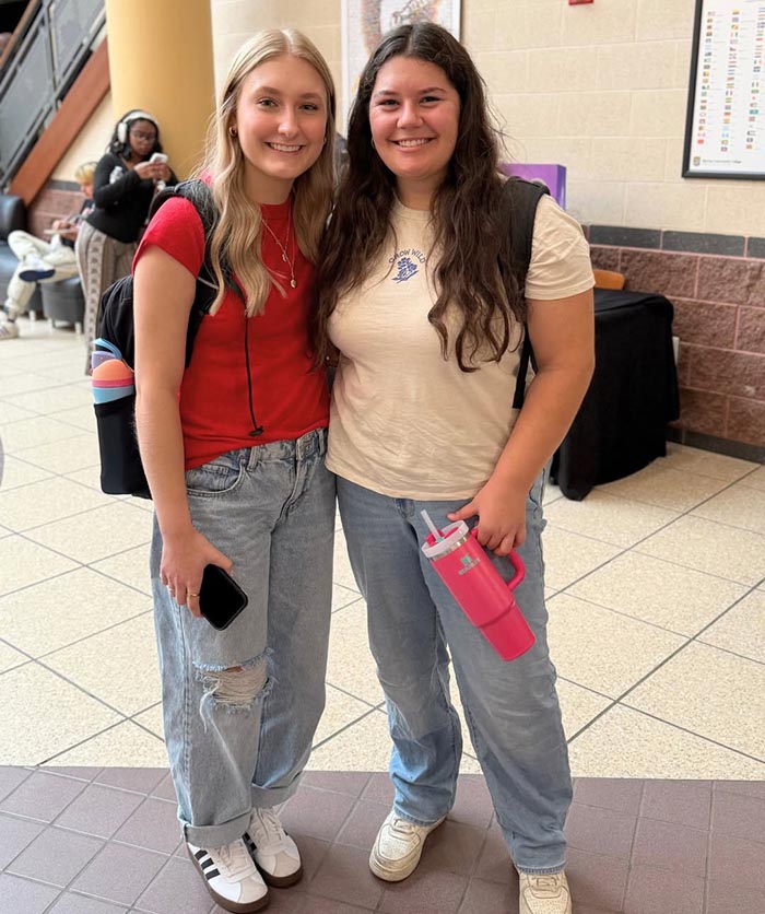 2 students smile for a picture