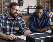 Professor with student in engineering lab