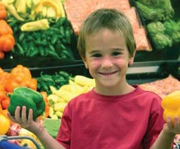 Boy holding fresh produce