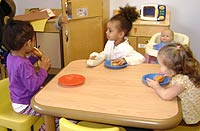 Children playing in housekeeping corner