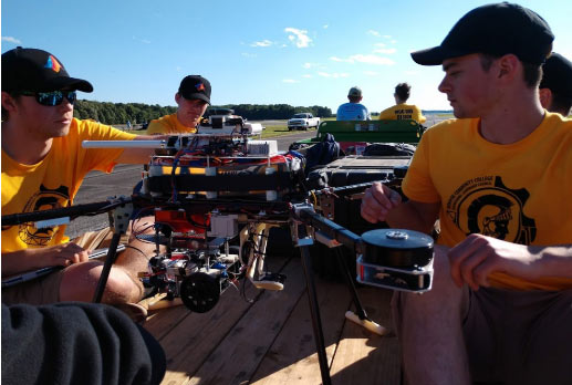 UAV-SUAS Design Team posing with their Drone