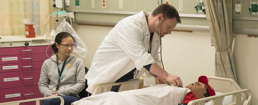 Photo of nursing instructors demonstrating in a clinical setting