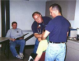 Photo of faculty and student doing basic assessments