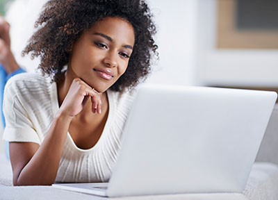 student looking at laptop screen