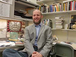 Photo of Professor Scott Rudd in his office