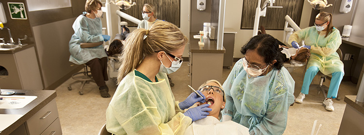 Dental students working on patients