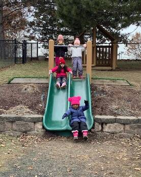 Children playing on a slide