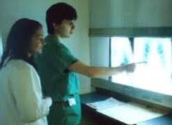 Radiology clinical supervisor reviewing radiographs with student