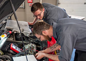 MCC auto tech students working on auto engine
