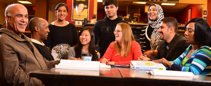 Diverse students laughing together