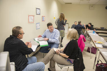 First year faculty meeting in small groups.