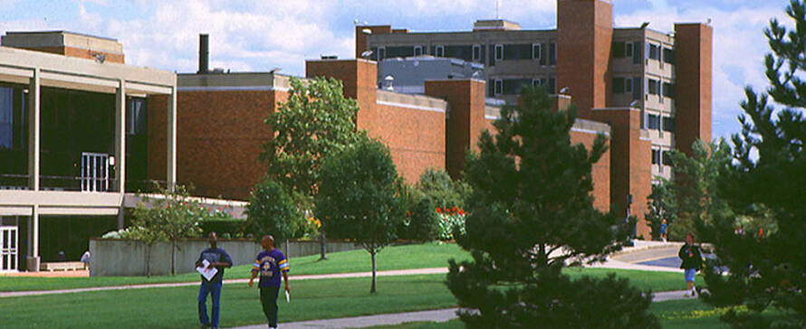 Students walking in front of campus