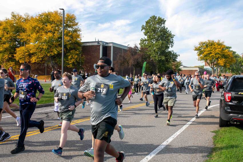 Participants running in the 19th Annual 5K Walk/Run for Scholarships