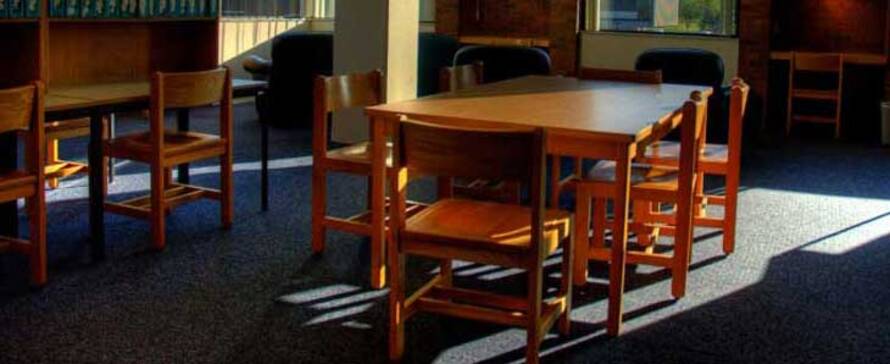 Photo of library tables and study areas.