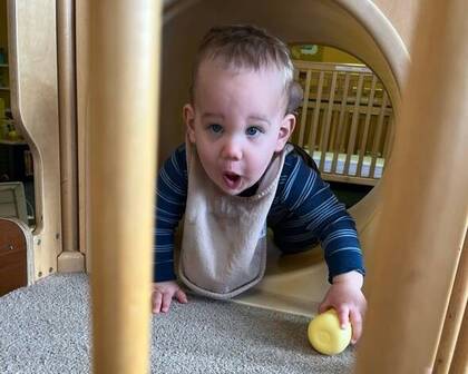Child playing on an indoor slide