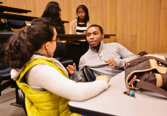 Students talking in lecture hall