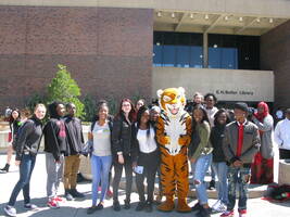 students on Buff State campus with Benji the Bengal mascot