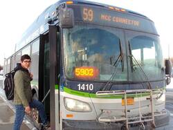 Student stepping on to an RTS bus