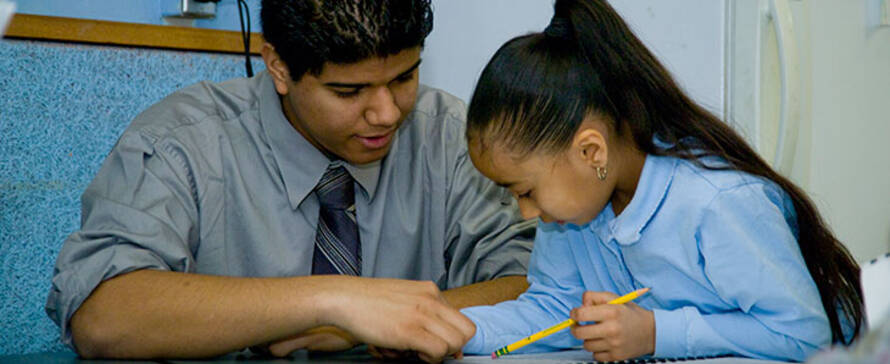 Child getting tutored.