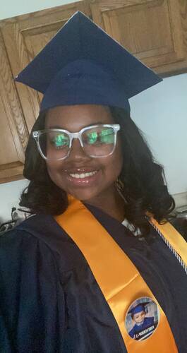 Tylynn Davidson, pictured in her cap and gown worn for her graduation from World of Inquiry in the Rochester City School District