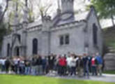 A crowd of people standing outside Mt Hope Cemetary