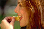 girl eating orange slice