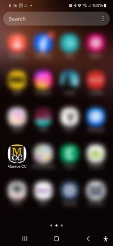Screenshot of a mobile phone screen showing the black, yellow and white logo of MCC.