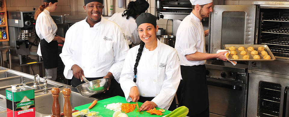 MCC students preparing foods in the culinary kitchen lab