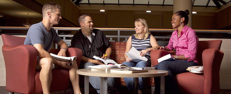 Students meeting with staff