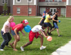 students engaging in a balloon race