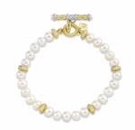 Photo of a beautiful pearl bracelet with gold detailing.