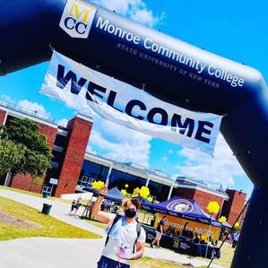 Student at MCC welcome sign.