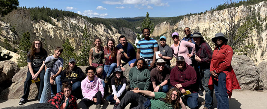 Students in front of the Lower Falls of the Yellowstone River in Yellowstone National Park