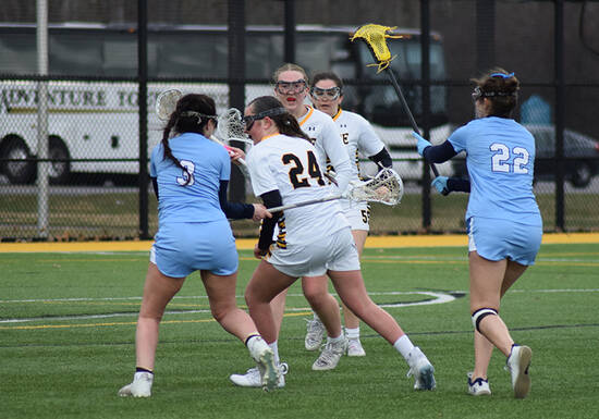 Student athletes playing lacrosse