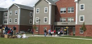 Students standing outside of residence hall building